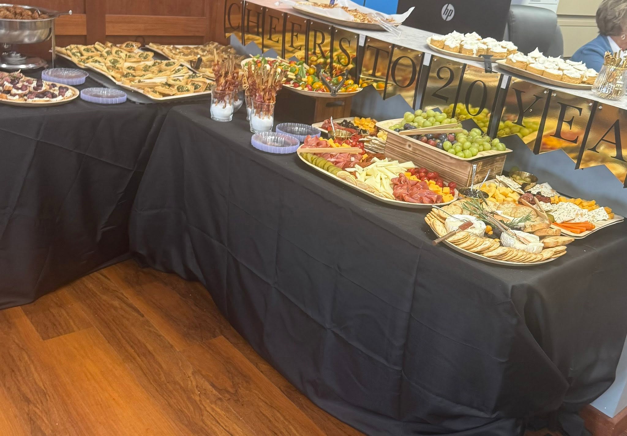 Sunnyside catering grazing table with cheeses, meats, crackers, fruit and appetizers