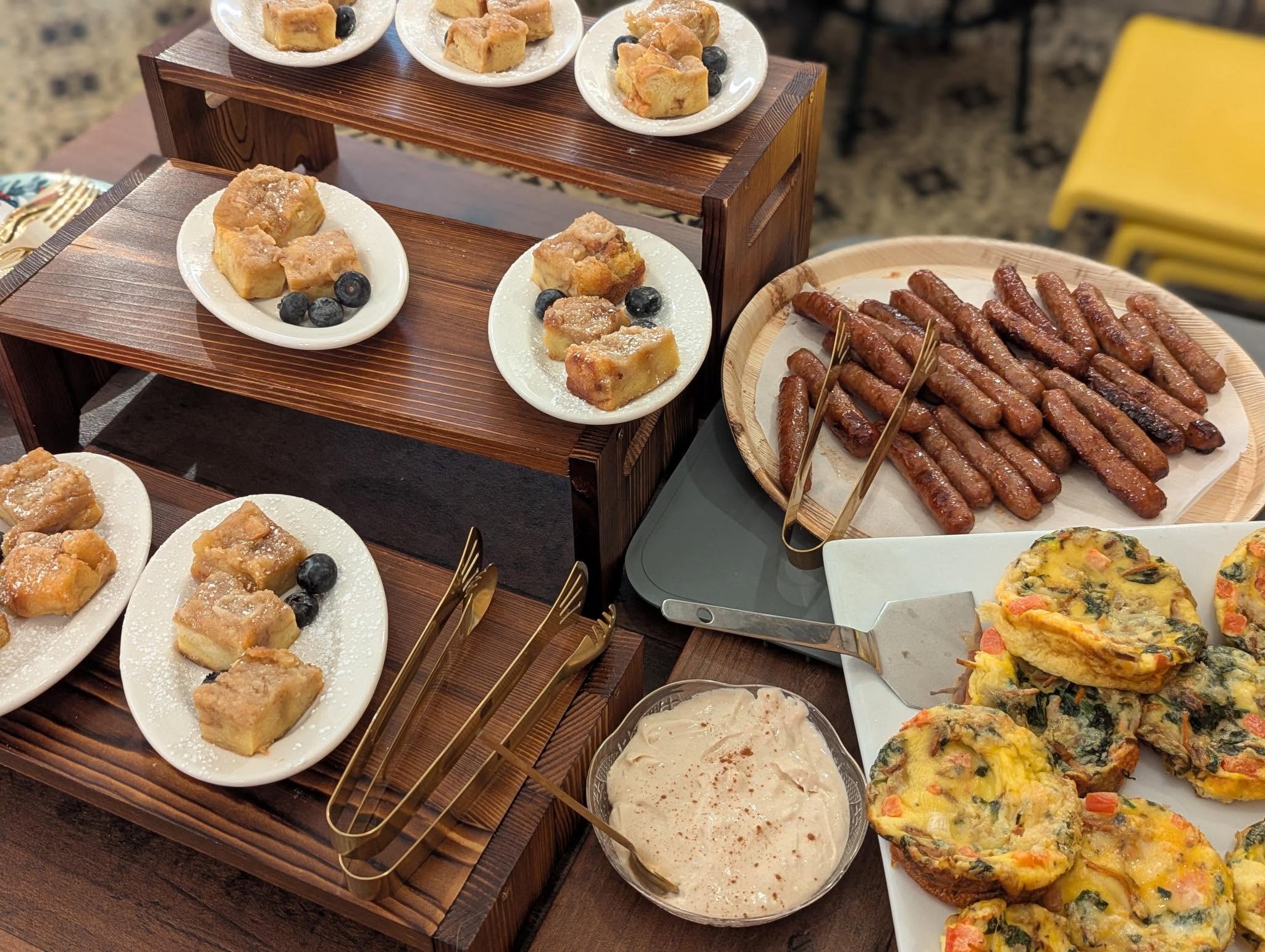 Sunnyside breakfast catering spread with egg bites, sausage and individual baked dishes