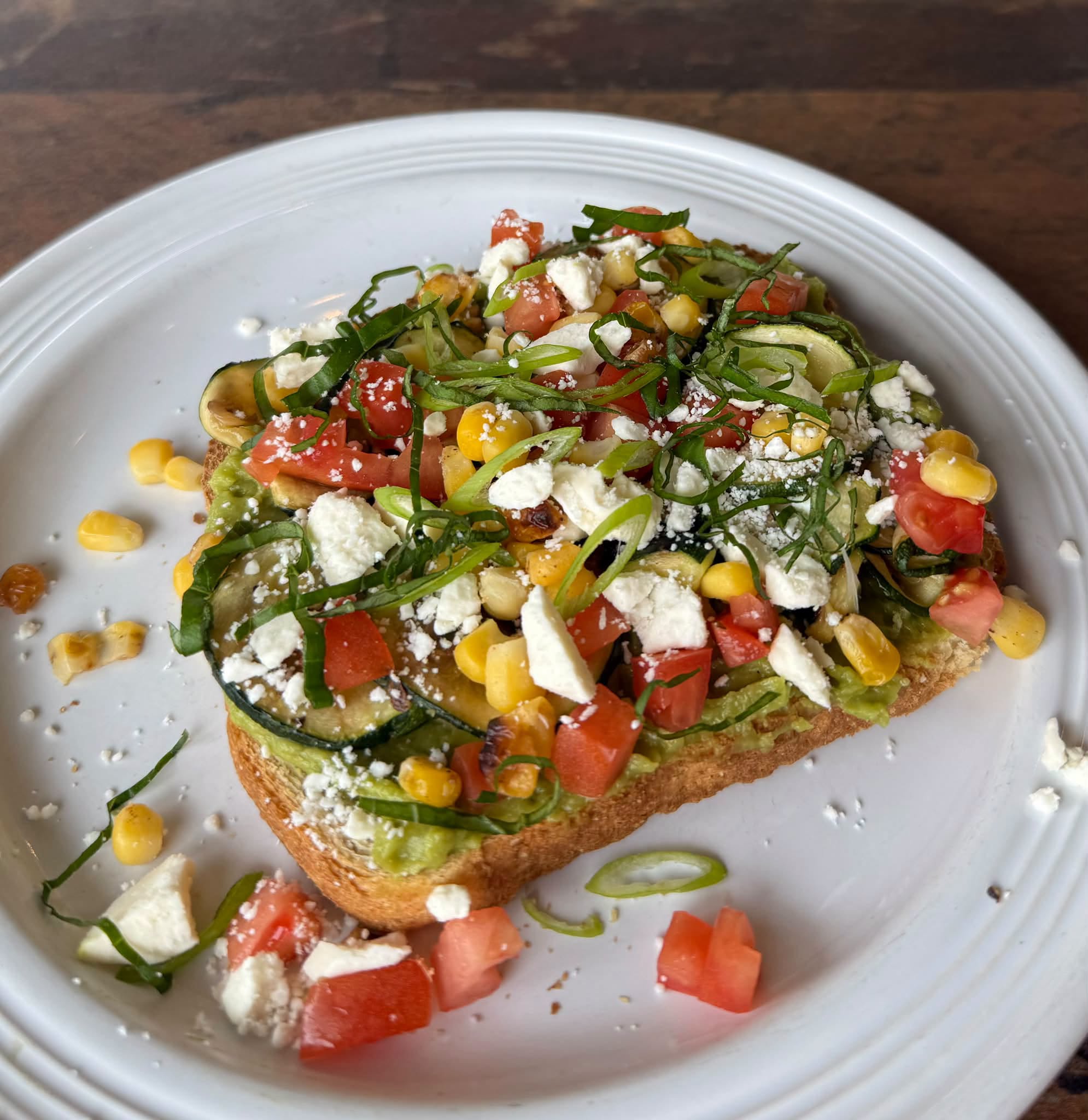 Sunnyside Cafe avocado toast with zucchini, corn, tomatoes, feta and basil